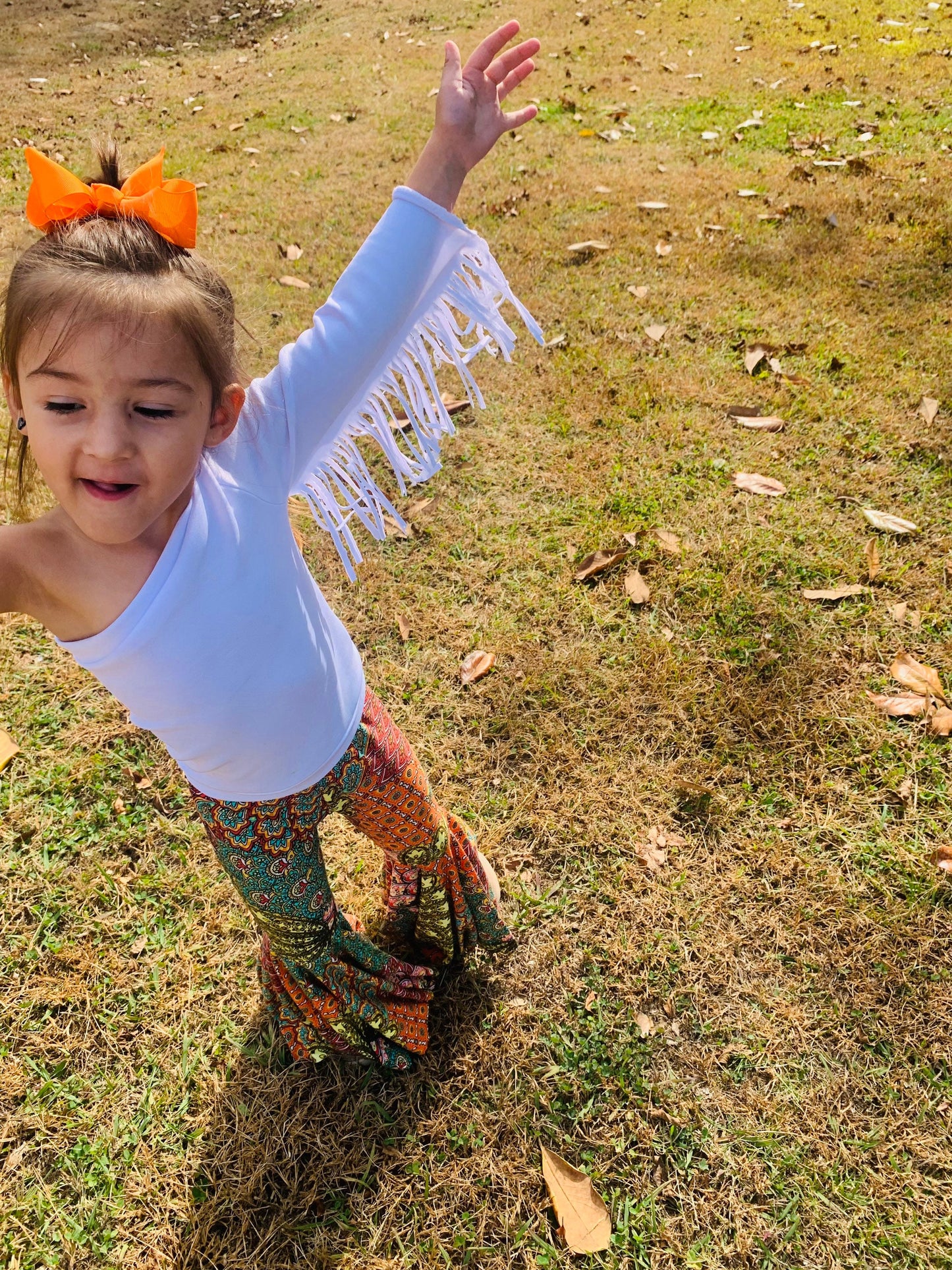 Retro Vibes: Bell Bottom Pants & One Shoulder Fringe Top for Kids - Trendy and Comfortable Outfit for Dancing and Playtime! WHOLESOME GOODS